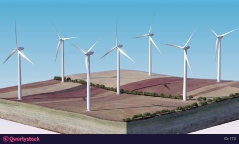 Wind generators standing on an isolated island. The camera zooms in.
