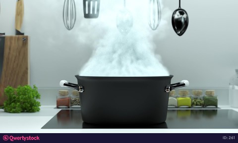 Robot hands throw vegetables into boiling water
