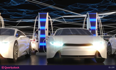 Charging electric vehicles in the parking lot. Neon rays create a charging electric field.