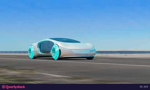 The concept electric car rides against the background of solar panels.