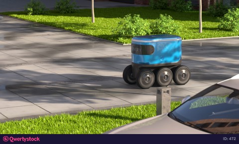 Autonomous delivery robot drives along the street