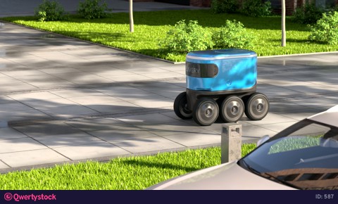 Autonomous delivery robot drives along the street