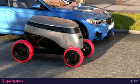 Autonomous delivery robot drives on sunset street