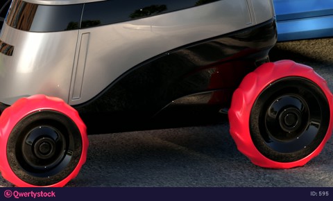 Autonomous delivery robot drives on sunset street